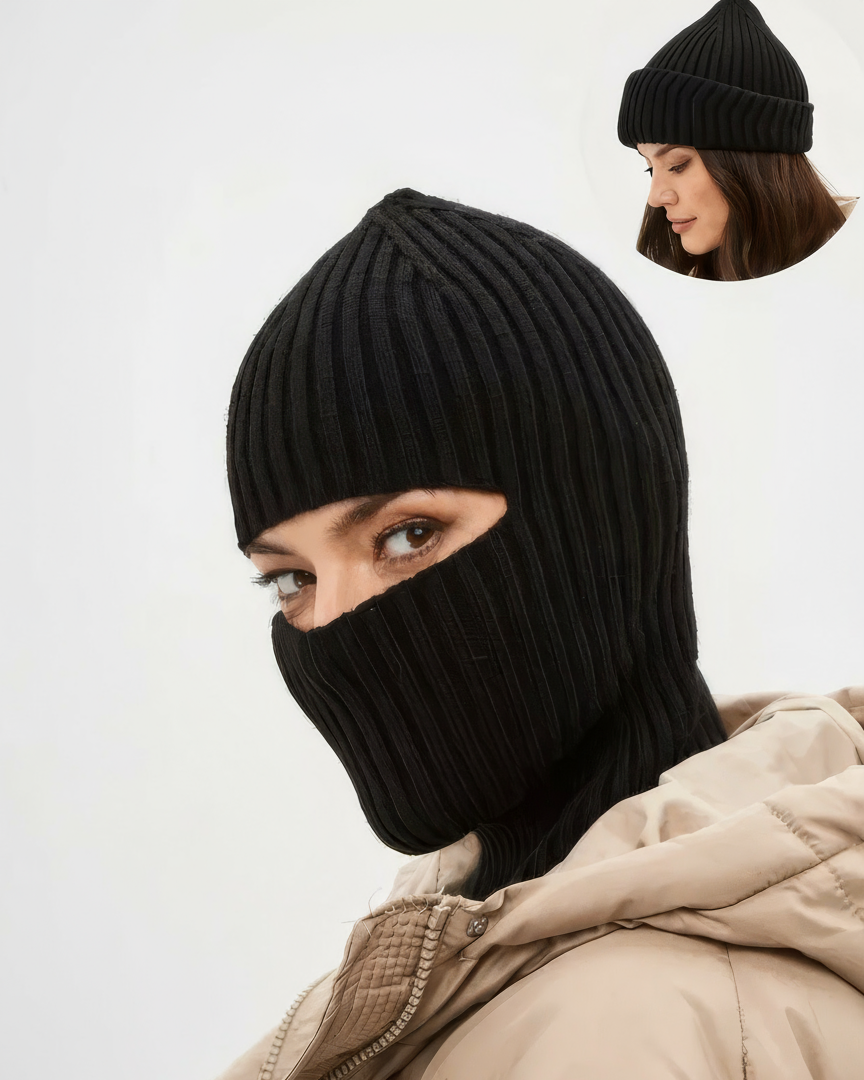 Person wearing a black knit balaclava with a beige coat on a white background