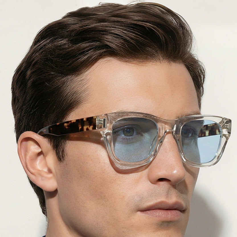 Man wearing sunglasses with a neutral background