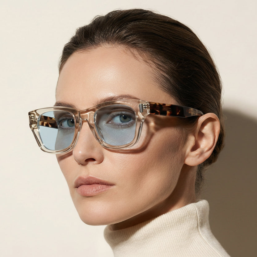 Woman wearing glasses with a neutral background