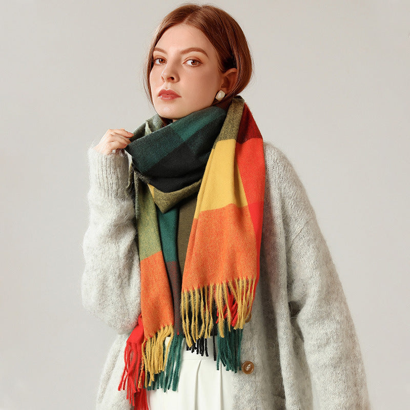 Woman wearing a colorful scarf with a neutral background