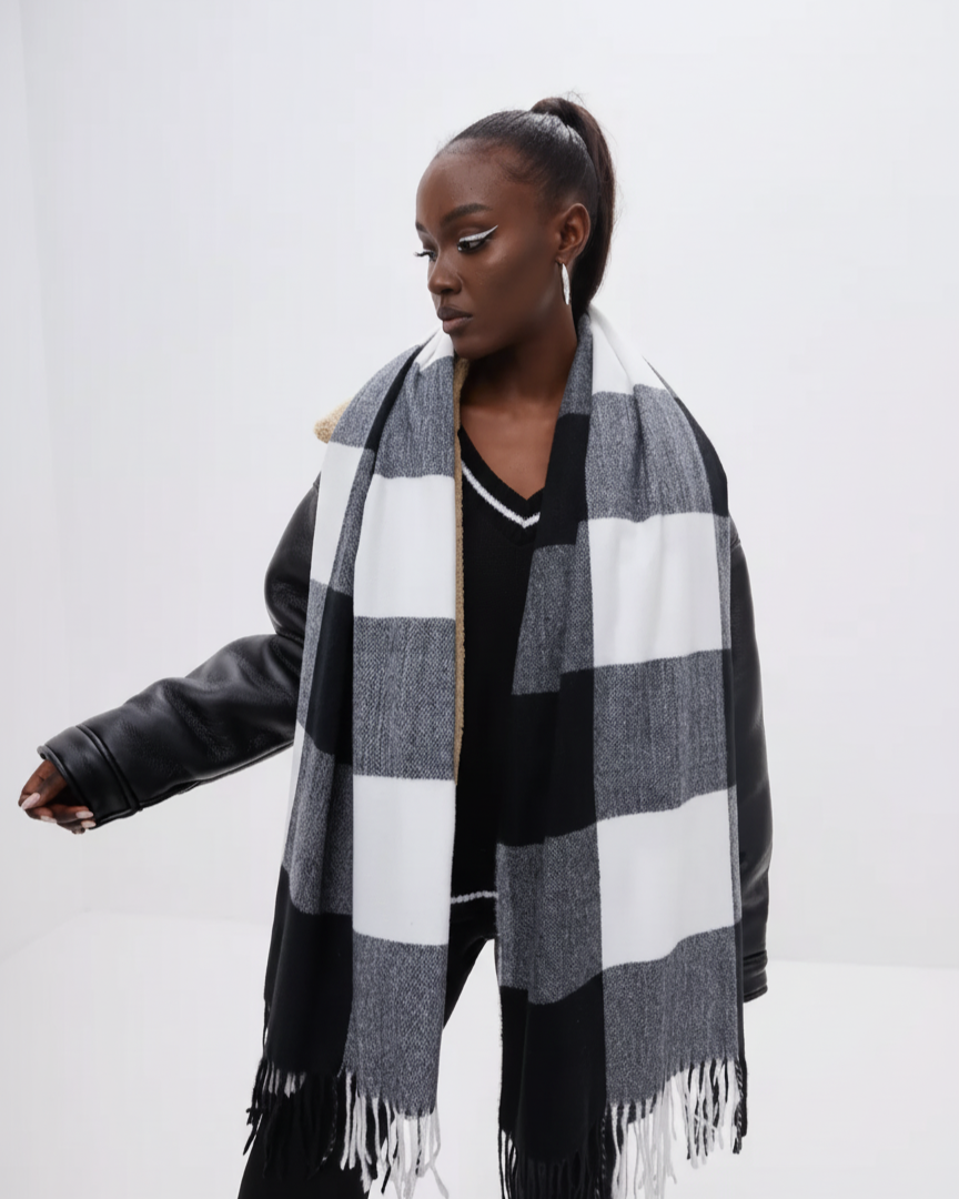 Woman wearing a black and white checkered scarf on a white background