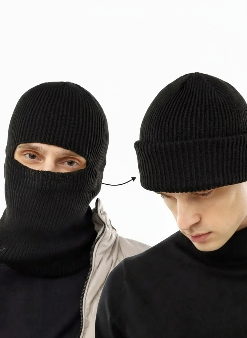 Two black knit hats worn by a person on a white background