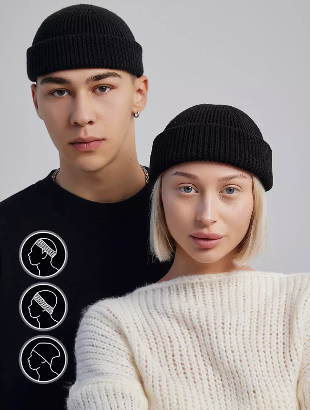 Two people wearing black beanies with icons on a gray background