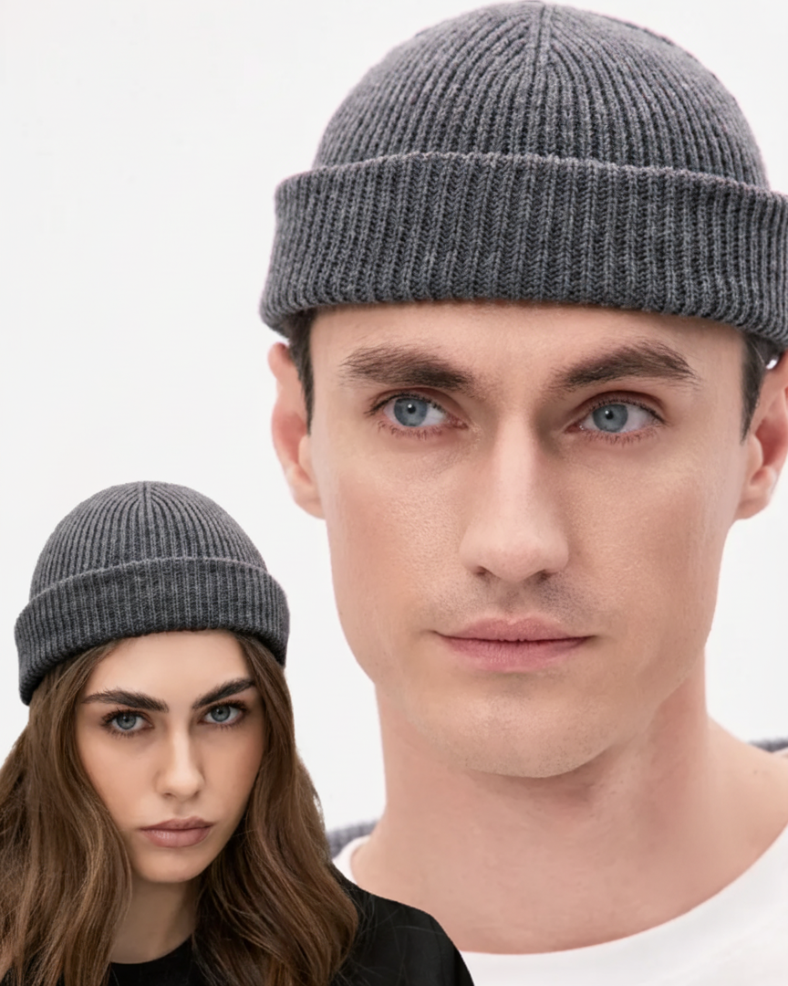 Two people wearing gray knit hats against a white background